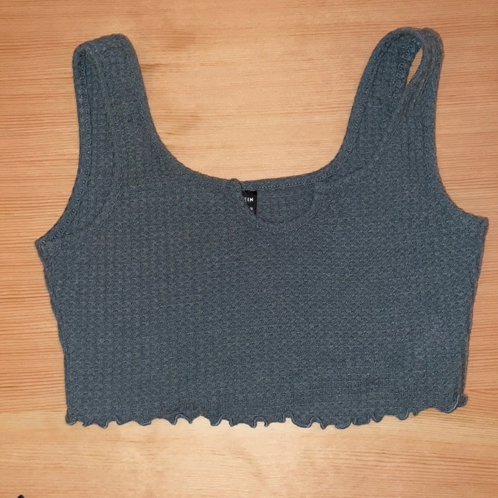 Green tank top. A little short  but in good condition. only worn once.